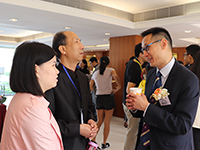 Guests exchange with Professor Edwin Chan (right)